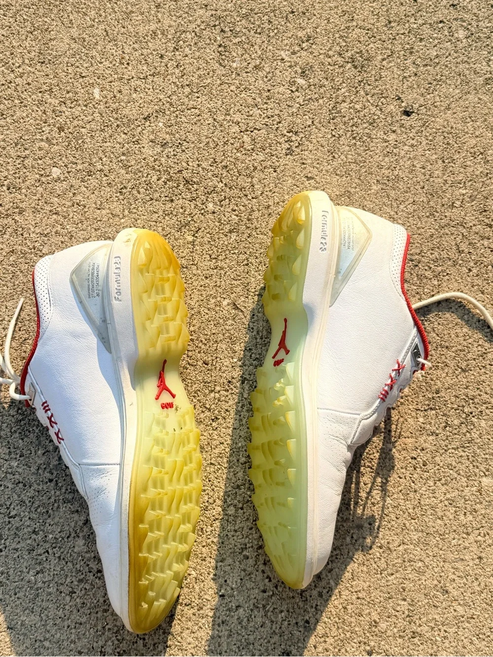 Jordan ADG 5 Golf Shoes in the White/Fire Red/Metallic Silver colorway